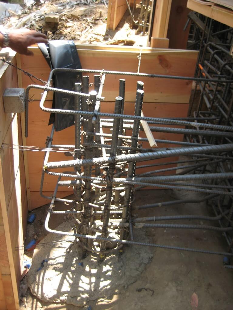 Tie concrete pier in to House Foundation Using rebar and Helical Tie Back